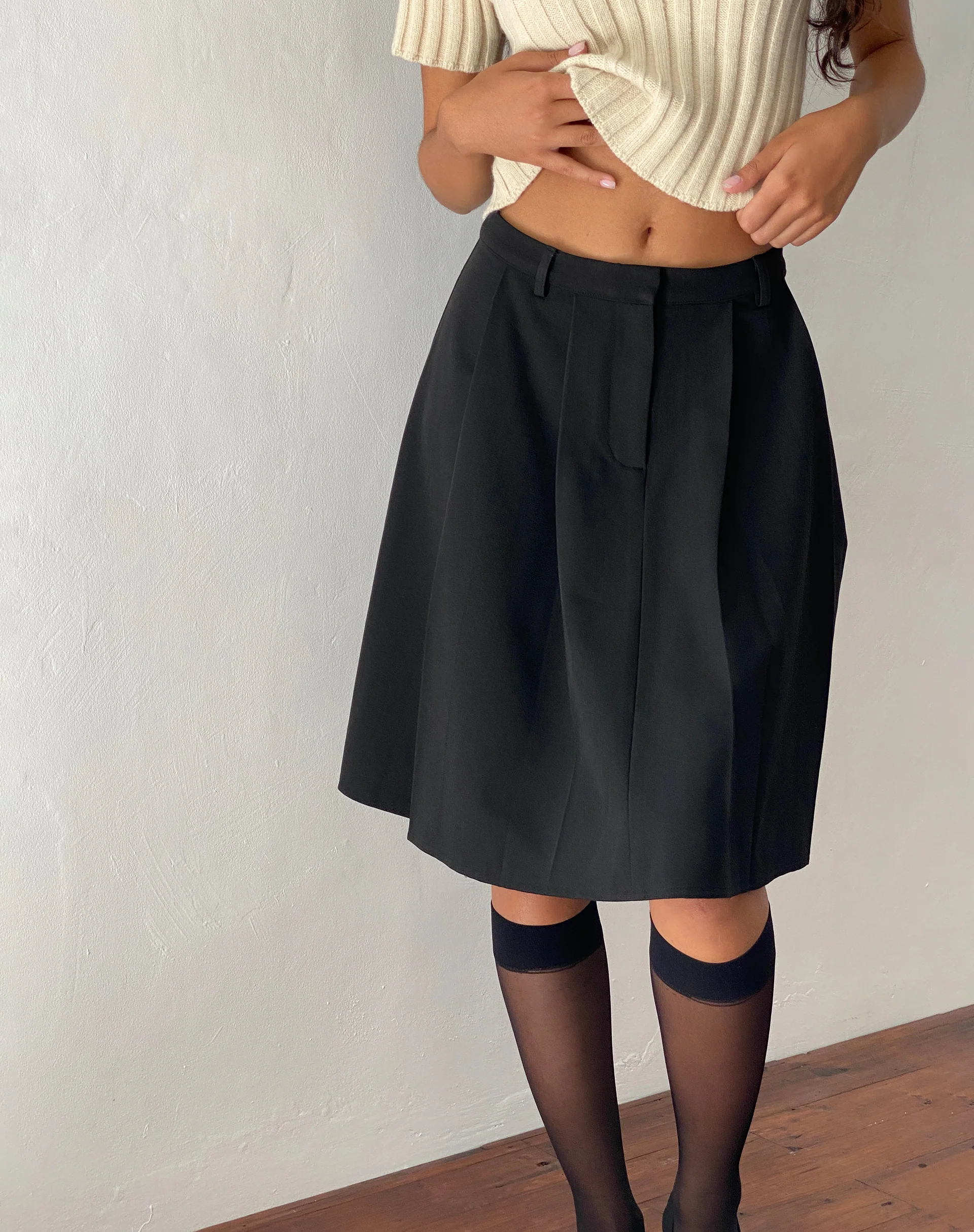Colette Pleated Knee Length Skirt in Black Tailoring - Awmao